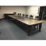 An extensive carved oak Victorian dining room suite, comprising of extending dining table,