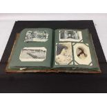 An early twentieth century postcard album containing a large quantity of postcards, rural scenes,