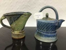 Jane Hamlyn (born 1940): A salt glaze teapot, in blue/green glaze, incised decoration,