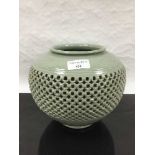 A Chinese Celadon type vase, with detailed banded reticulated walls,