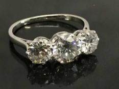 A three stone diamond ring, approximately 2ct, clarity Vs-Si, Colour F-I, size L.
