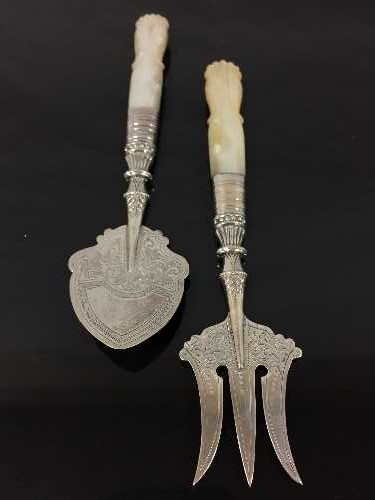 A silver and mother of pearl handled preserve spoon and bread fork, J. Milward Banks, Birmingham.