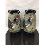 A pair of Czech amphora ware vases decorated with birds, 41cm.