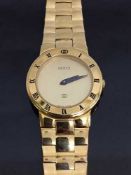 A Lady's gold plated Gucci wrist watch, model 3300L, in retail box .