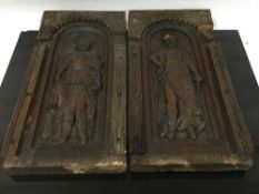 A pair of nineteenth century carved oak wall panels decorated with noble figures, 45cm.