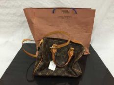 Louis Vuitton : A lady's Speedy hand bag, monogram canvas with tan trim, with zip top,