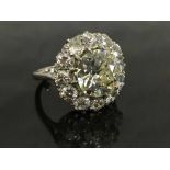 An important platinum diamond ring, the central old European cut stone approximately 3.