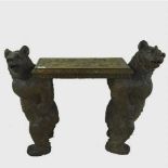 A Black Forest carved seat, supported by two bears, height 62 cm.