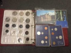 An extensive collection of coins to include two albums containing Crowns, one Shilling pieces,