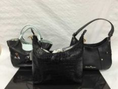 Jaeger : A lady's hand bag, black leather, with brass fittings, with zip top,