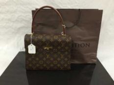 Louis Vuitton : A lady's Malesherbes hand bag, monogram canvas with tan trim,