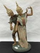 A Lladro bisque figure of two Thai girls dancing in traditional dress, height 53cm.