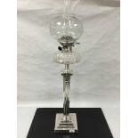 An impressive silver plated Corinthian style crystal and etched glass oil lamp, height 89cm.