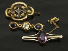 A 9ct gold bar brooch set with an amethyst,