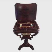A William IV mahogany sewing table on paw feet, height 71.5 cm.