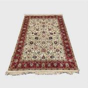 A silk finished Persian carpet on cream ground 154 cm x 226 cm.