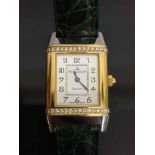 A Jaeger-Le-Coultre Reverso wrist watch in two-tone gold encrusted with diamonds, numbered 1879662,