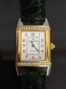 A Jaeger-Le-Coultre Reverso wrist watch in two-tone gold encrusted with diamonds, numbered 1879662,