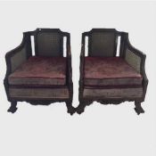 A pair of late nineteenth century oak bergere armchairs, width 77 cm.