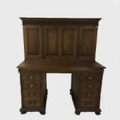 An Edwardian oak pedestal desk with cabinet above, by Thomas Sopwith & Co.