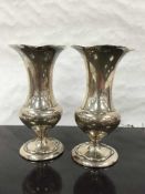 A pair of silver vases, A & J Zimmerman, Birmingham 1907, of waisted form with trumpet bowls,