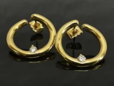 A pair of 9ct gold diamond set hoop earrings.