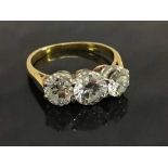 An 18ct gold three stone diamond ring, approximately 2.02ct, clarity Si-1, colour H-I, size M.