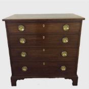 A George III mahogany four drawer chest on bracket feet,