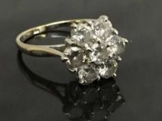 An 18ct white gold diamond cluster ring, approximately 1.5ct, size L/M.