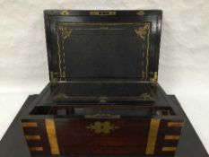 A Victorian oak and brass bound writing slope, with tooled leather interior, width 40cm.