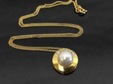 An 18ct gold pearl and diamond pendant on fine 18ct chain.