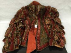 An early twentieth century doublet of high quality, elaborately decorated with velvet and gold wire,