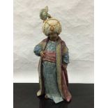 A Lladro bisque figure of a Persian gentleman, height 40cm.