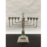 A sterling silver menorah, Rosenzweig, Taitelbaum & Co, London 1932,