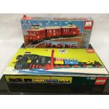 Four Lego sets, all relating to trains, numbers D182, 7725, 7725 and 7740, all parts boxed.