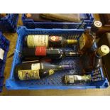 Crate of alcohol including a bottle of Mckinleys whisky, Bells whisky, Three barrels brandy etc.