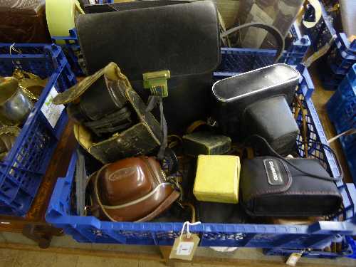 Basket of assorted cameras and photographic equipment including Zenit, Olympus, light meter,