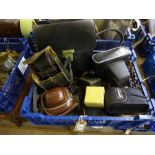 Basket of assorted cameras and photographic equipment including Zenit, Olympus, light meter,