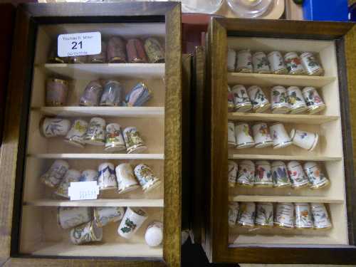 Eight small thimble cabinets containing a quantity of china thimbles including Staffordshire and