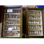 Eight small thimble cabinets containing a quantity of china thimbles including Staffordshire and