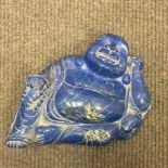 A large Chinese lapis lazuli carving depicting a Buddha, height 13.5 cm, length 18.5 cm, 2400.8g.