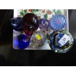 Seven assorted glass paperweights including Caithness,