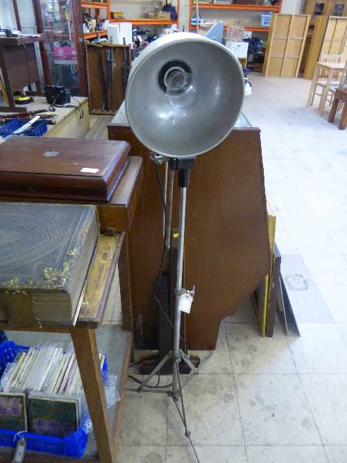 Mid twentieth century metal adjustable industrial style lamp together with four wooden rules