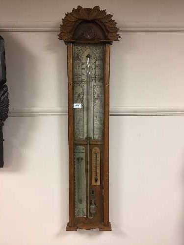 A nineteenth century carved oak Admiral Fitzroy mercury barometer.