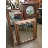 Two early 20th century hall mirrors and a walnut framed mirror