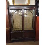 A Victorian display cabinet on claw and ball feet