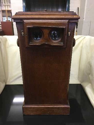 A Victorian mahogany stereoscope viewing box, with internal carousel and approximately 120 + slides.