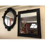 An ornate blanket framed mirror and one other