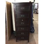 A stained pine six drawer chest