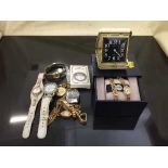 A bag of assorted wrist watches, dressing table clock,